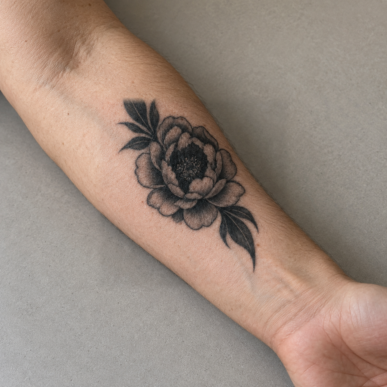 Real generated peony cover concept on the forearm source photo
